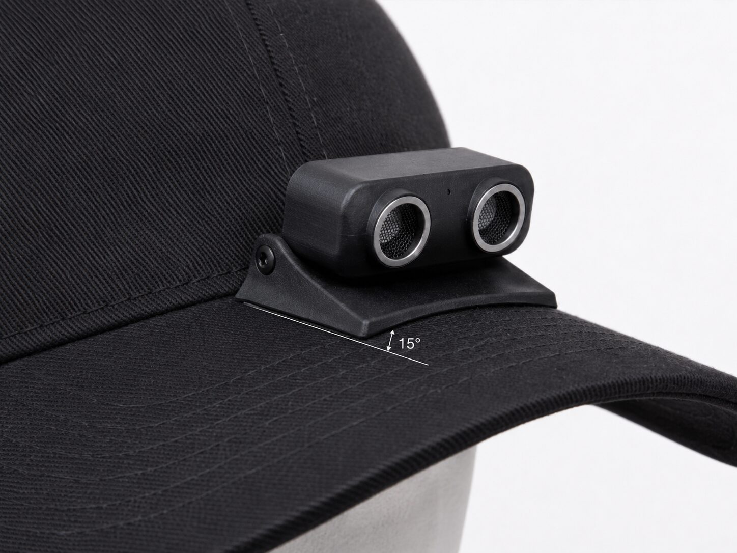 Concept mockup close-up of a small ultrasonic sensor mounted on a cap brim, angled 15 degrees upward.